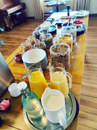 buffet breakfast with fruit juice and cereals